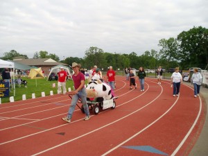 Steven walking on the track while pulling a wagon